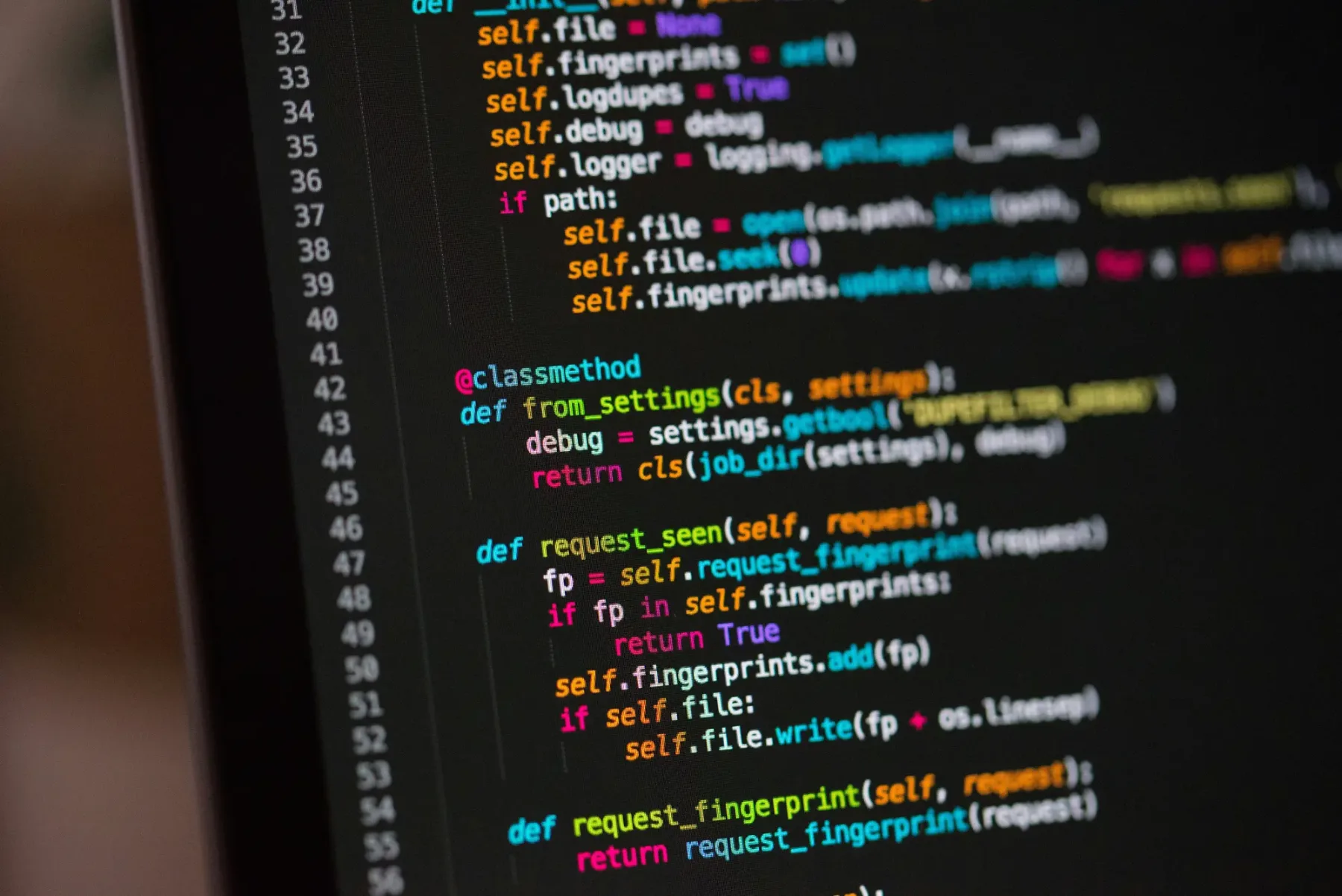 Code open in an editor on a dark screen, representing custom Shopify development work
