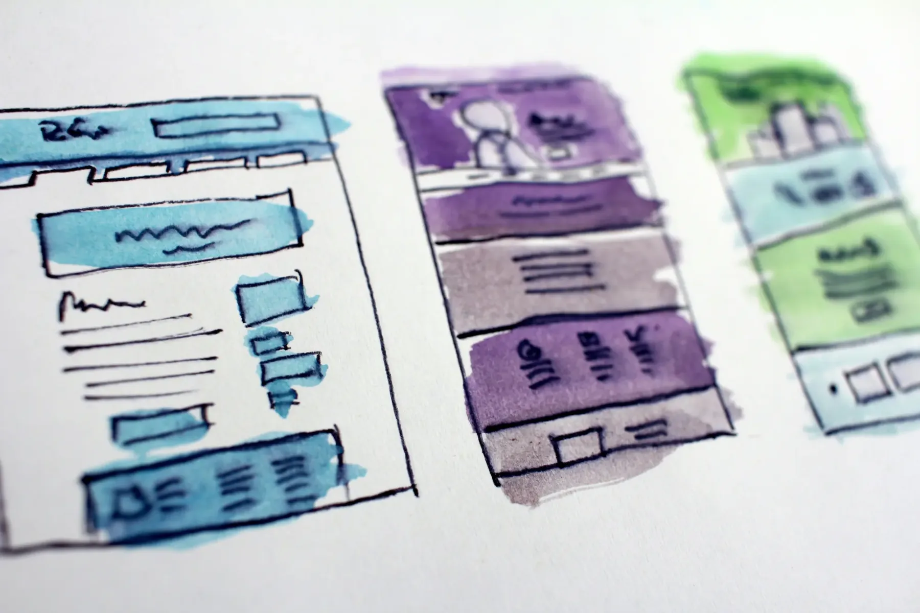 Hand-drawn wireframe sketches of website homepage layouts, showing how a hero section is planned