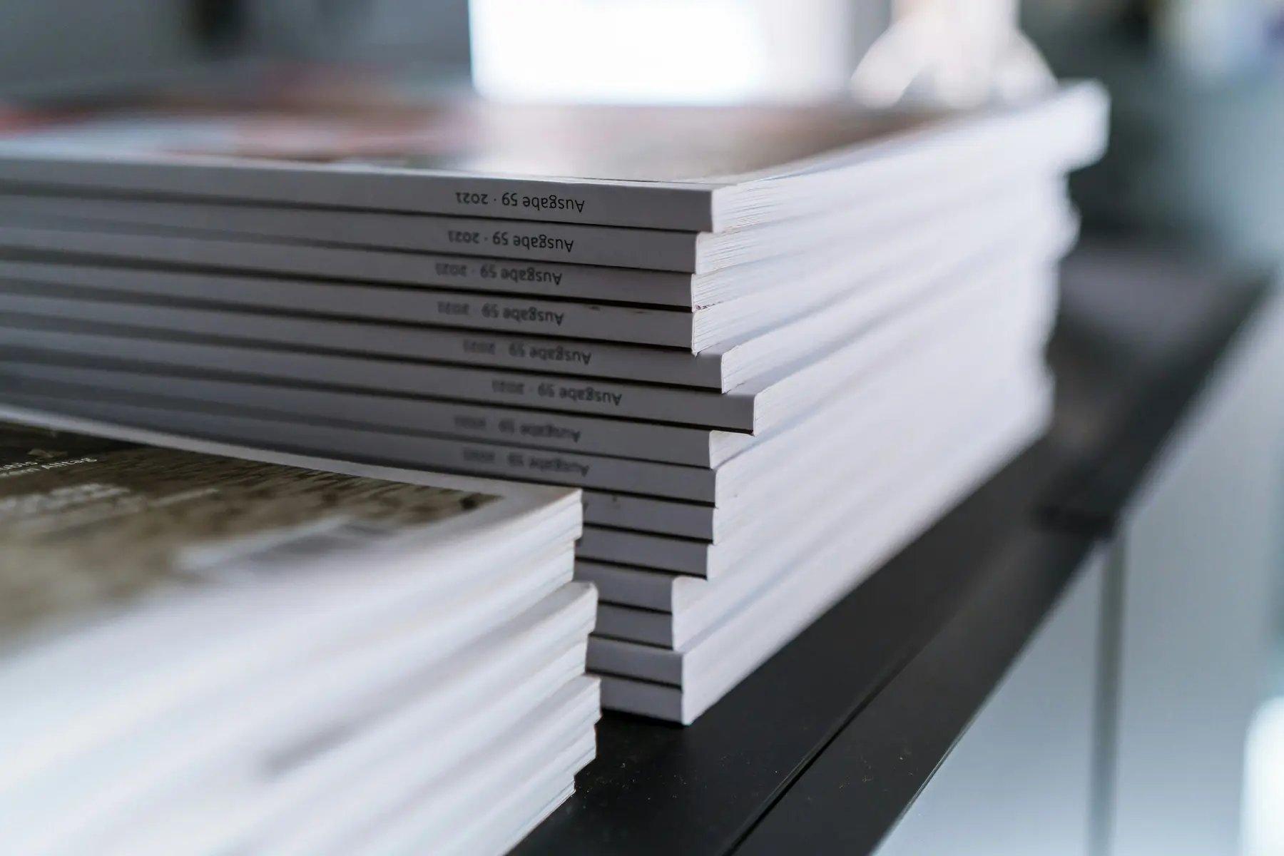 Stacks of printed copies, representing updating a duplicate draft theme rather than the live one